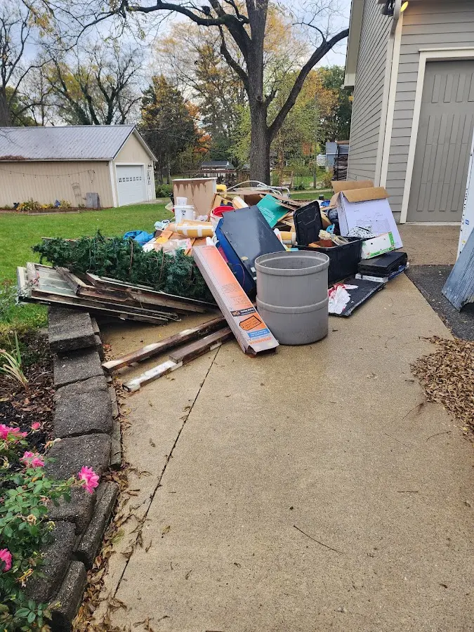 Dumpster being loaded with debris for Commercial Dumpster Rental in Chillicothe